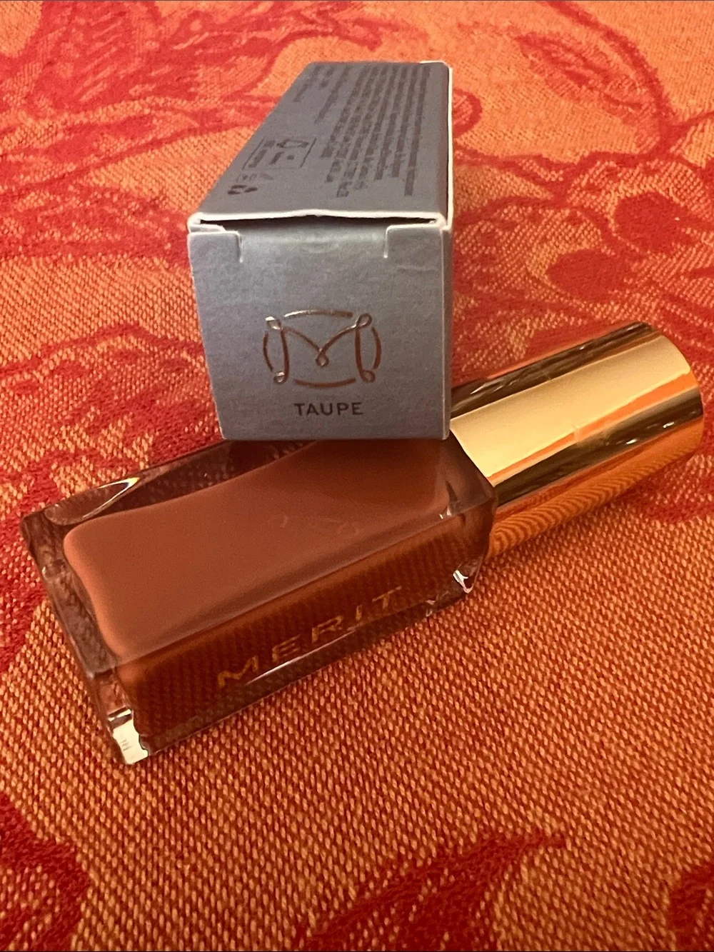 Merit- shade stick- Tinted Lip Oil in taupe